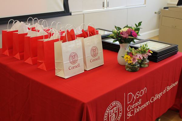 Table of gift bags and framed awards