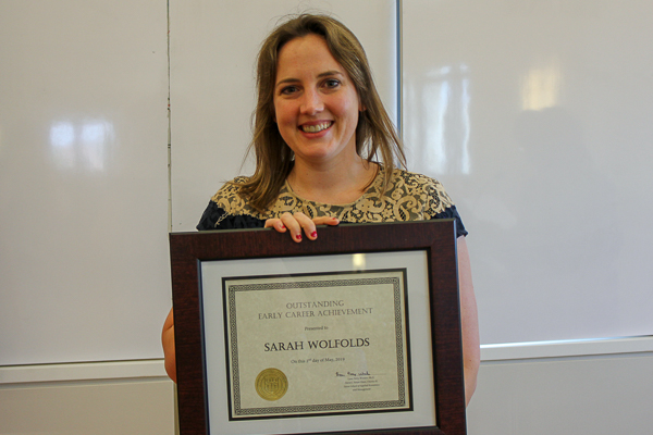 Sarah holding her award