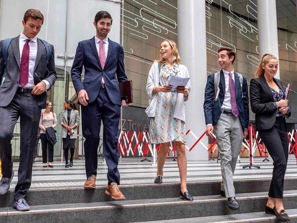 Students walk down city steps