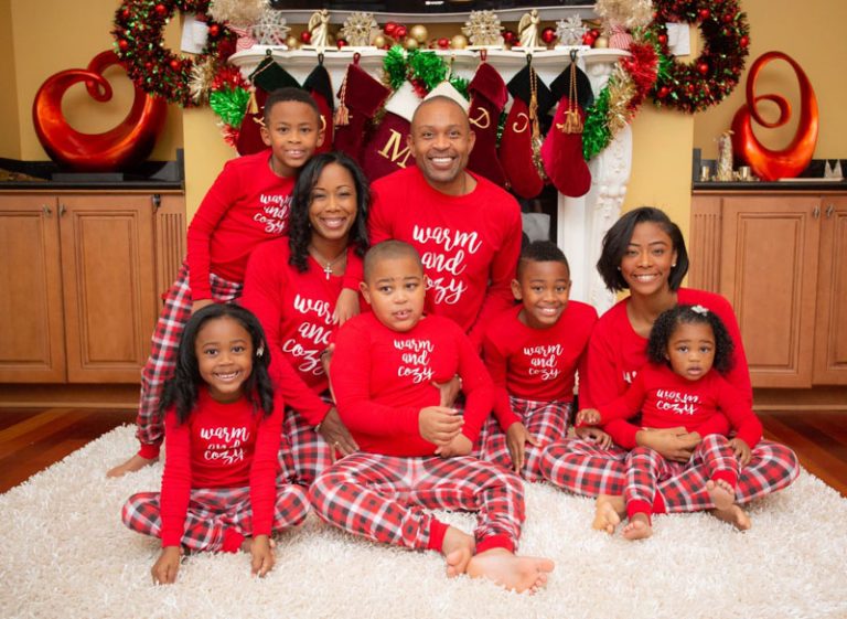 Dwane and his family dressed in Christmas pajamas