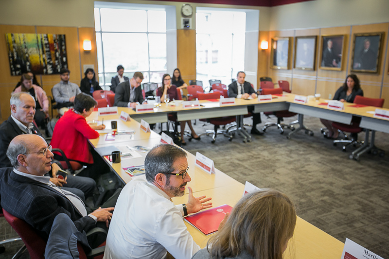 Faculty and guests around a table