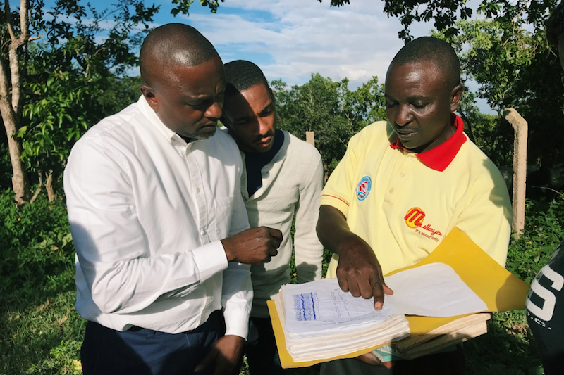 Looking over documents in the field