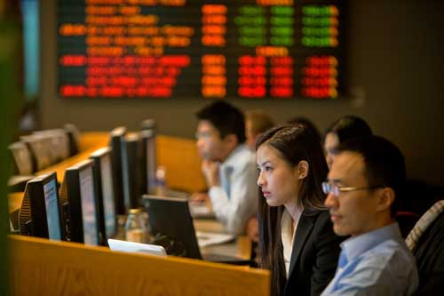 Students sitting near stock tickers