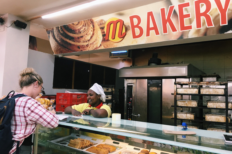 A student interviews a worked in the bakery