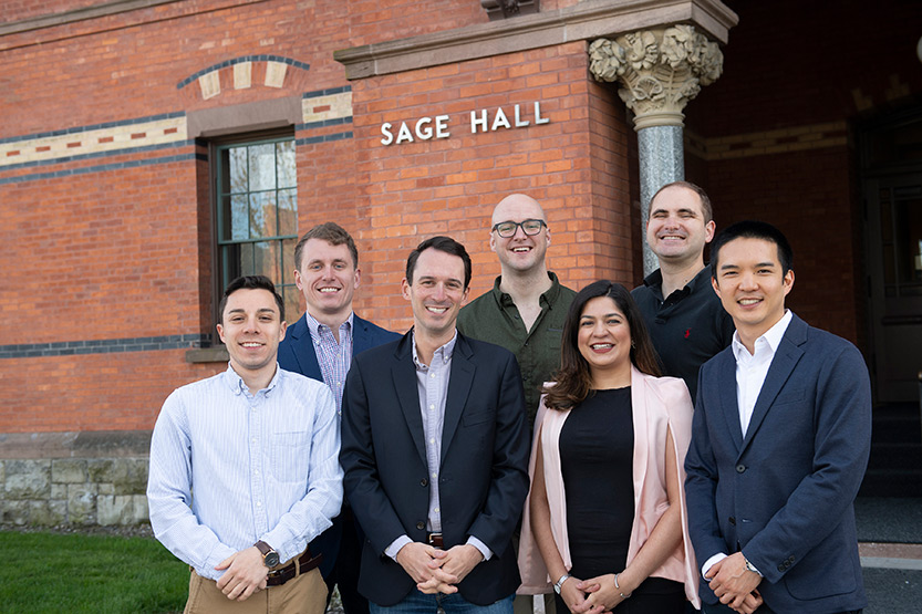 photo of Present Value producers standing outside Sage Hall