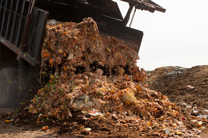 Garbage truck dumping enormous amounts of food waste