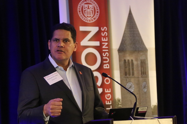 Reggie standing at a podium