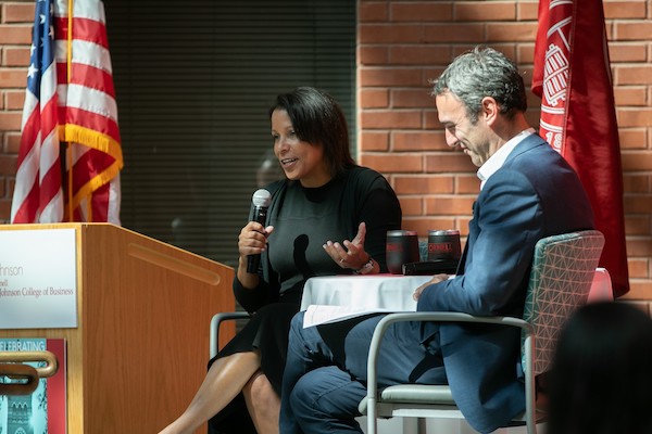 Angela and Drew on stage at the JWiB symposium