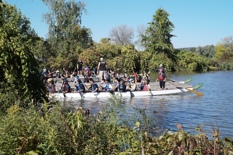 Students on the lake in their boats 