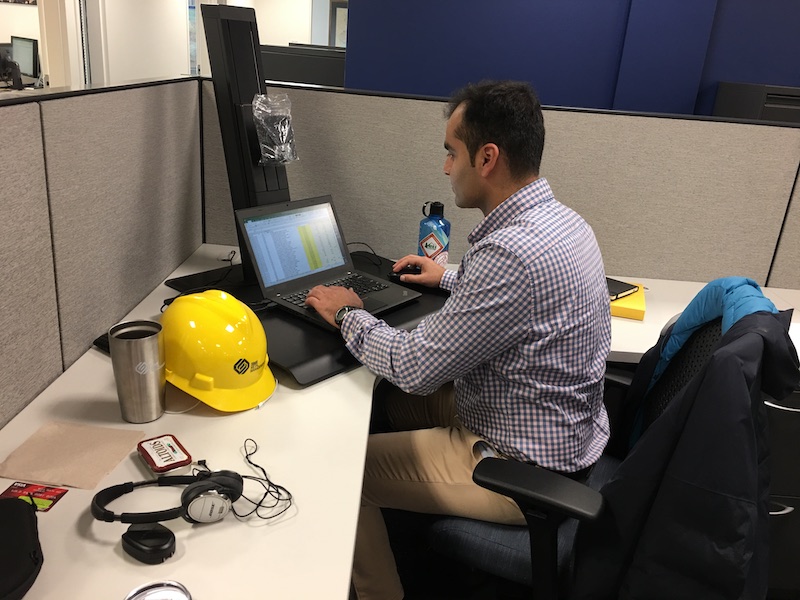 Nikunj at his computer in his office