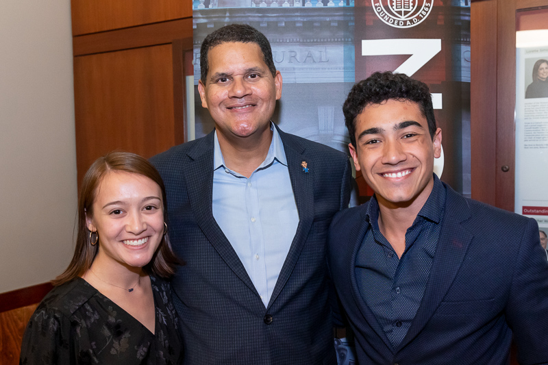 Students standing with Reggie