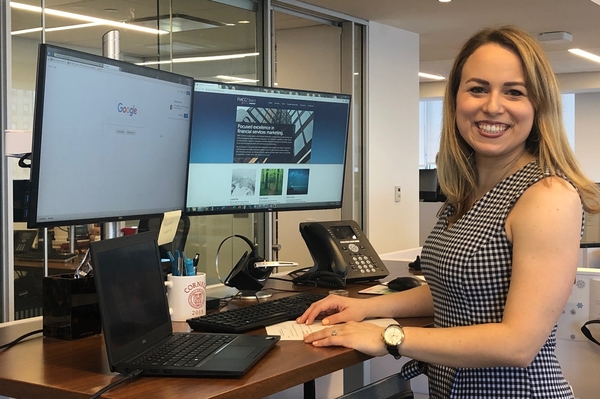 SHA alumna Cassandra Rampino '18 at her desk