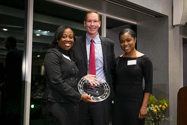 pictured left to right: Marmeline Petion-Midy, Dean Mark Nelson, and Sophia Marseille