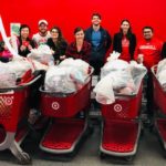 People standing with receipts and shopping carts at Target