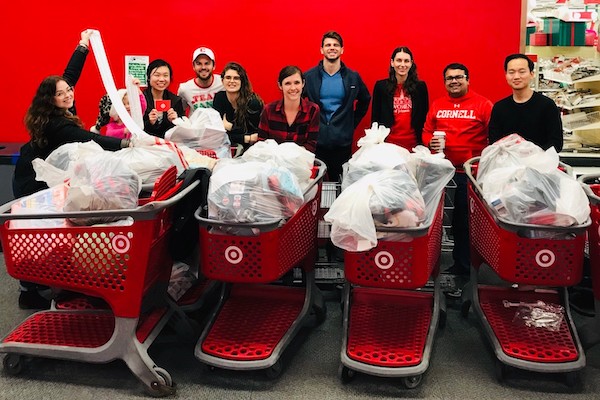 People standing with receipts and shopping carts at Target