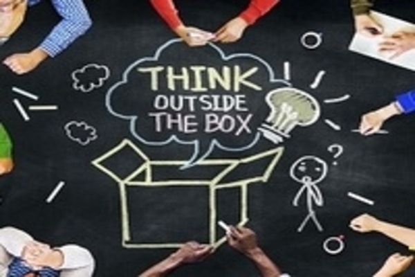 Chalk drawing that says "Think Outside the Box"