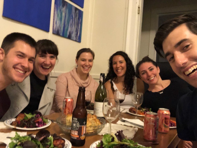 MBA students seated around a dinner table.