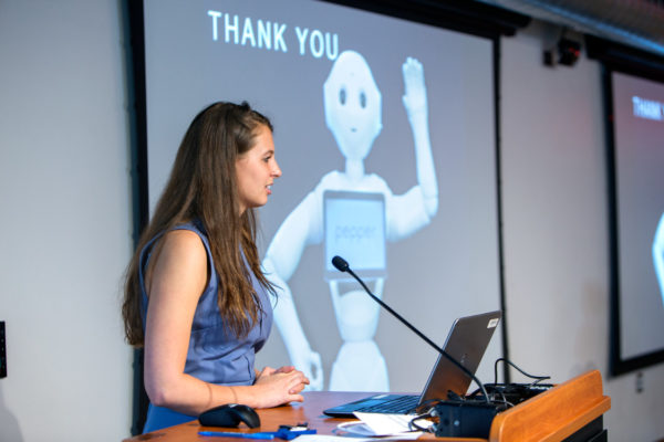 A student presenting about Pepper the robot