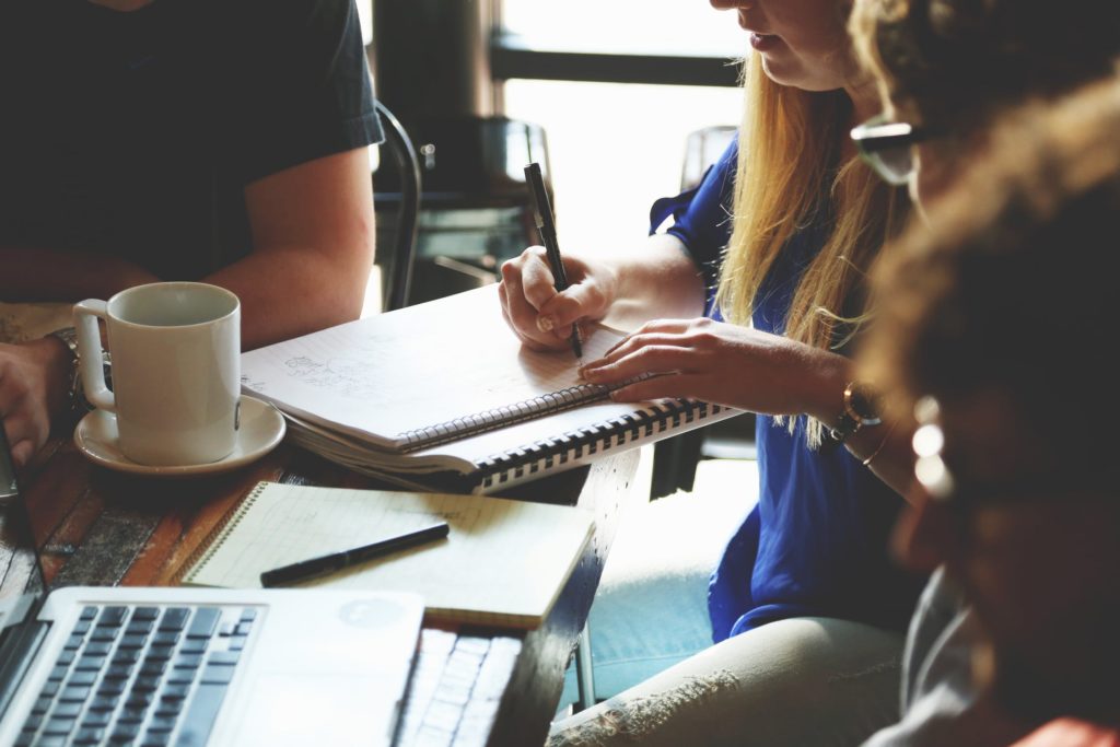 Professionals discussing papers around a table