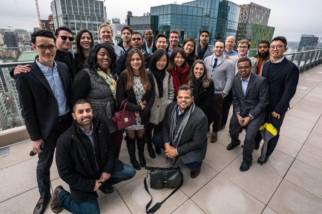 Students pose with the Seattle skyline in the background