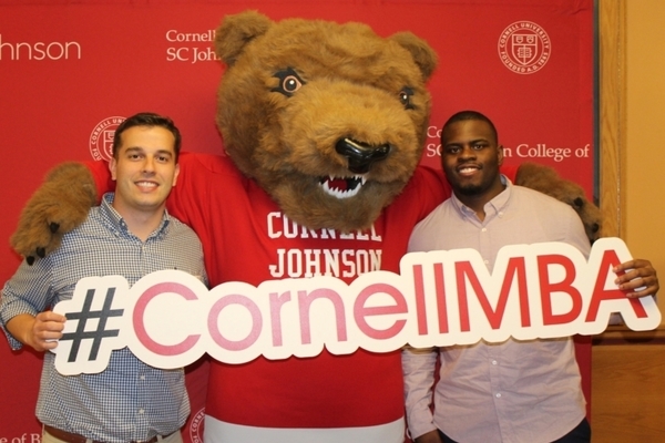 Cornell MBA students with Touchdown the bear