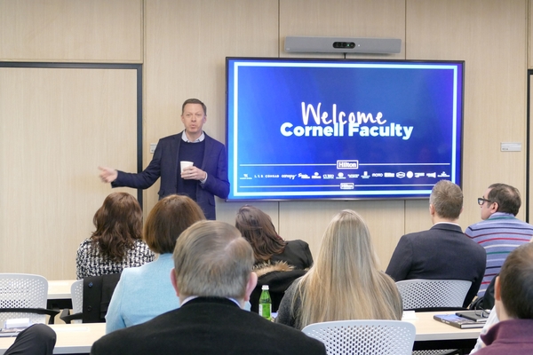 Kevin Jacobs '94, Hilton's EVP and CFO, welcomes the group to Hilton headquarters.