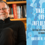 portrait of Professor Robert H. Frank next to the cover of his new book, Under the Influence