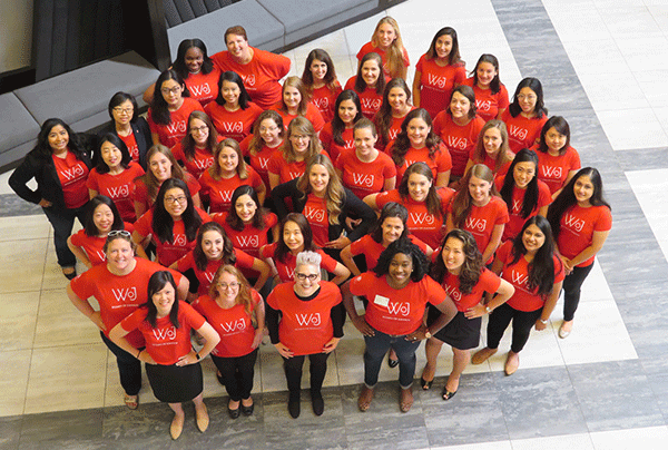 large group photo of the Women of Johnson wearing matching red WoJ t-shirts