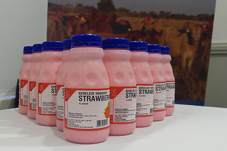 Pink yogurt drinks on a table