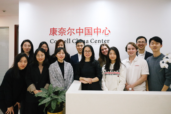 A large group of students standing in a lobby