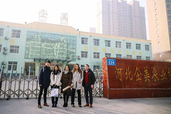 A group stands outside the headquarters building