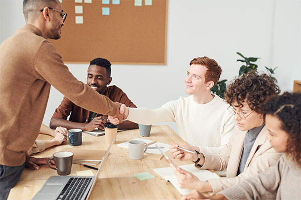 Group of professionals making a business deal.