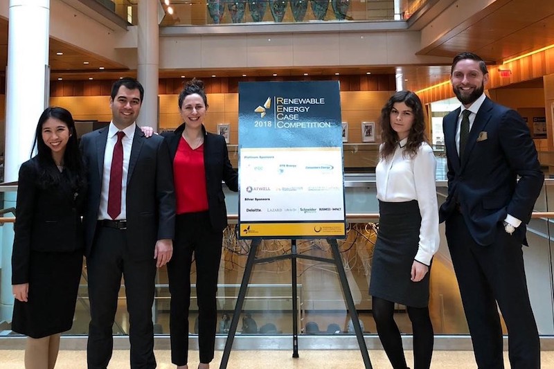 MBA students dressed in business attire at a case competition.