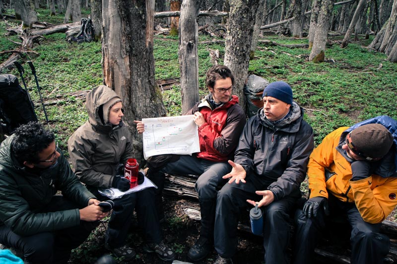 A group of students sitting in a forest