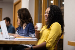 Kristen Collins, a graduate student in real estate and regional planning, listens in class.