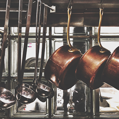 Hanging pans and ladles in a restaurant