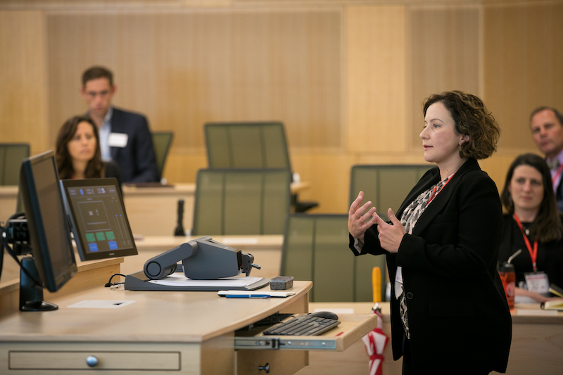 Margarita teaches students from the front of a classroom