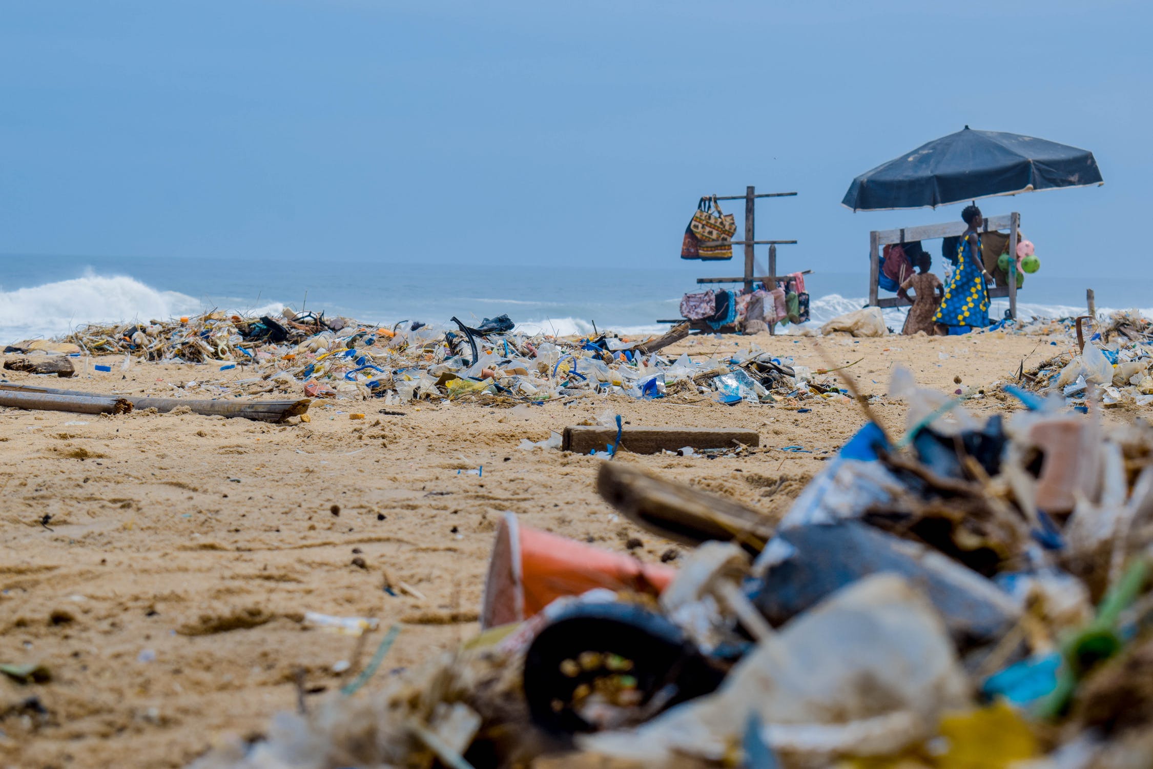 Plastic waste strewn about a beach