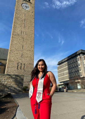 Quyen Nguyen in front of the Cornell clock tower