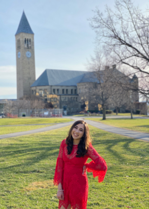 Eeshe Chona in front of the Cornell clock tower