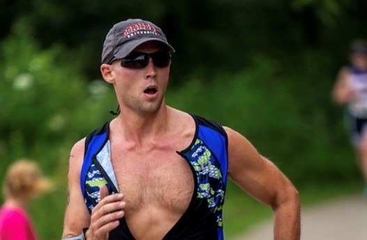 Greg running in a triathlon race