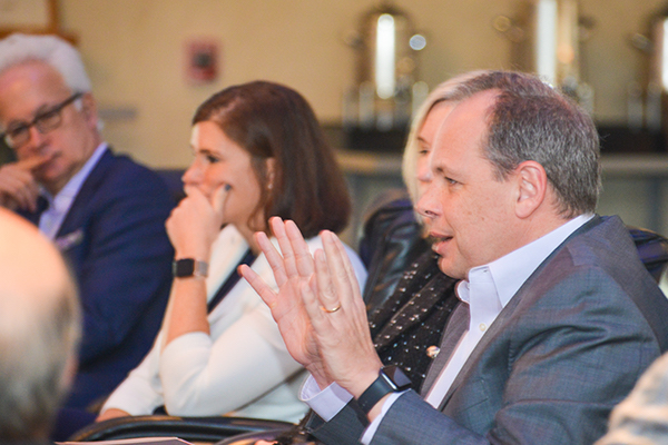 Roundtable attendees in discussion at a table
