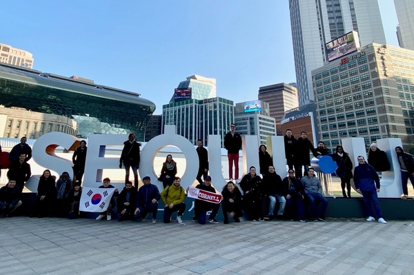 Trek participants pose at the Seoul sign in the capital city