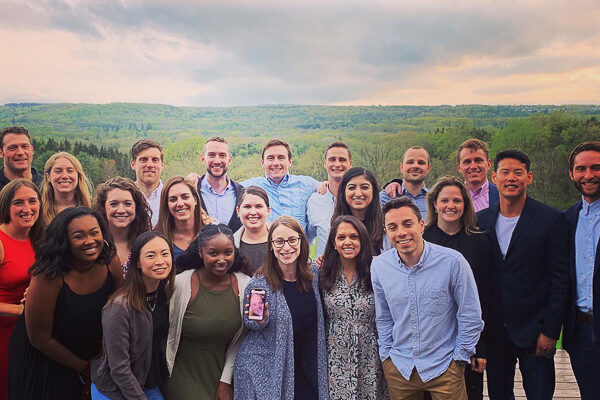 Alt text: Students in the Park Fellows Class of 2020 pose for a group photo at an outdoor event.