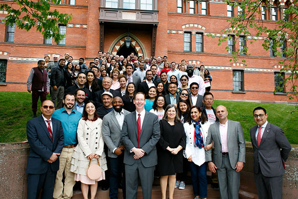 group photo of EMI Fellows with Johnson Dean Mark Nelson and Lourdes Casanova n the front and center