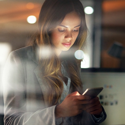 Woman looking at her phone/mobile device