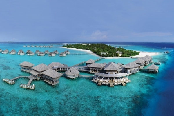 An aerial photo of a resort built on the water