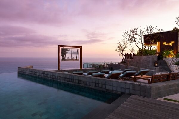 picture of an ocean resort outdoor cinema on the edge of the water at dusk