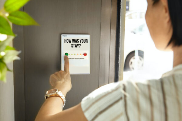 Photo of a person taking a survey about their hotel stay.