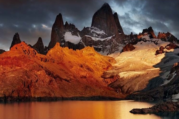 A beautiful, red mountain range lit by the setting sun